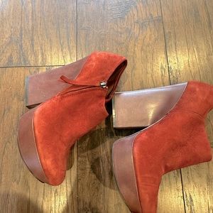 Boutique 9 size 9 1/2 4 1/2 inch platform Shoetie in a warm orange suede upper.